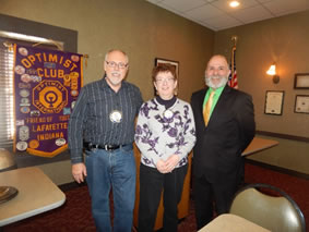 speaker poses with optimist president and speaker chair